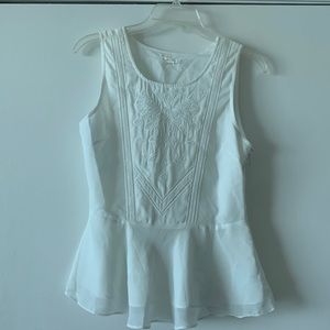 White sleeveless blouse